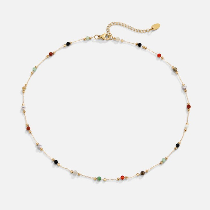 Helmina – Collar dorado colorido con acentos de esmalte.